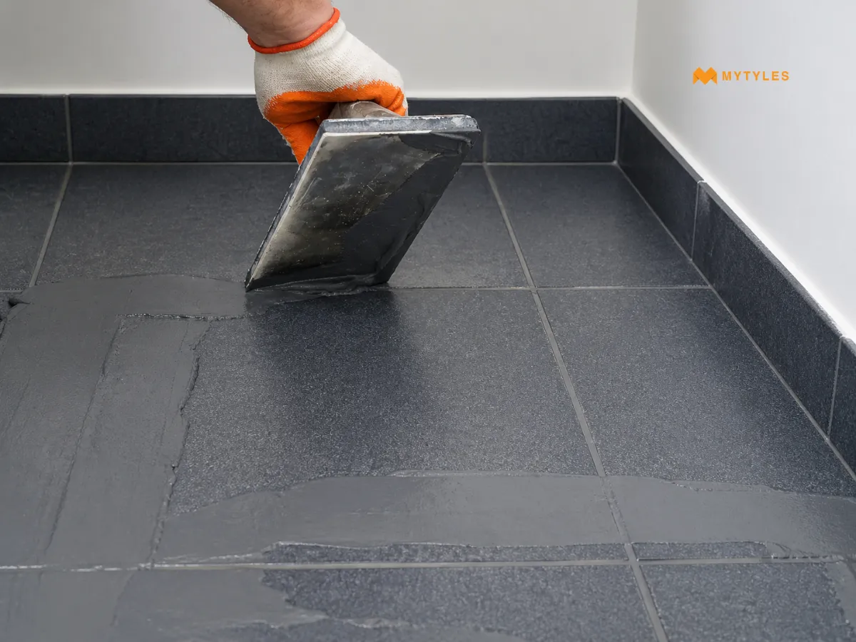 Grout Application on Dark Grey Tiles